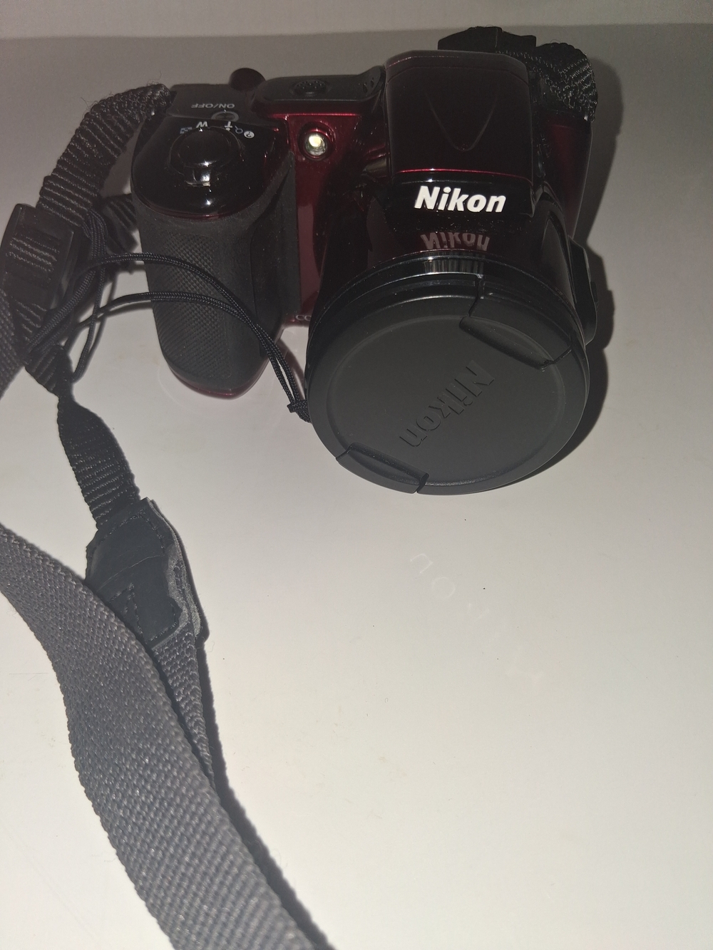 Nikon Red and Black Compact Digital Camera with Lens Cap